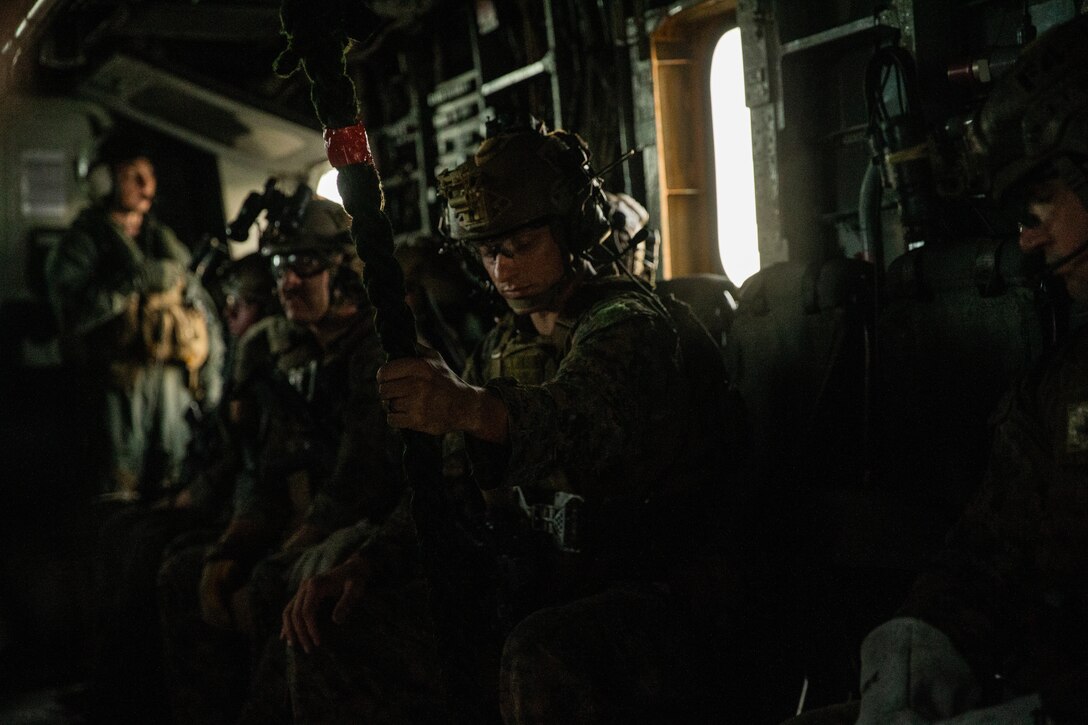 A Marine with the 31st Marine Expeditionary Unit's Maritime Raid Force secures a rope during a fast rope exercise as part of MRF’s Visit, Board, Search and Seizure training at Marine Corps Base Hawaii, Kaneohe Bay, Hawaii, Jan. 9, 2019. Fast roping allows Marines to quickly enter otherwise inaccessible locations from hovering aircraft. Reconnaissance Marines with MRF train for quick, tactical raids of moving vessels, launched from both land and sea. The 31st MEU, the Marine Corps’ only continuously forward-deployed MEU, provides a flexible and lethal force ready to perform a wide range of military operations as the premier crisis response force in the Indo-Pacific region. (U.S. Marine Corps photo by Cpl. Isaac Cantrell)