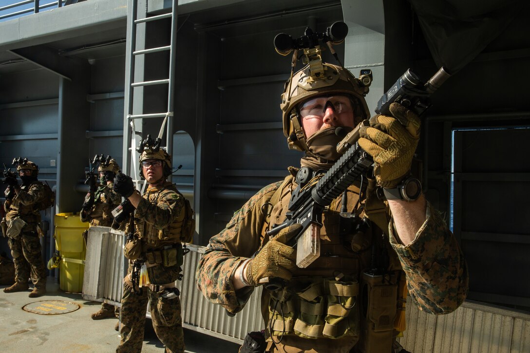 Marines with the 31st Marine Expeditionary Unit's Maritime Raid Force provide security aboard a simulated non-compliant vessel during Visit, Board, Search and Seizure training at Marine Corps Base Hawaii, Kaneohe Bay, Hawaii, Jan. 15, 2019. Force Reconnaissance Marines with MRF train for quick tactical raids of moving vessels, launched from both land and sea. The 31st MEU, the Marine Corps’ only continuously forward-deployed MEU, provides a flexible and lethal force ready to perform a wide range of military operations as the premier crisis response force in the Indo-Pacific region. (U.S. Marine Corps photo by Cpl. Isaac Cantrell/Released)
