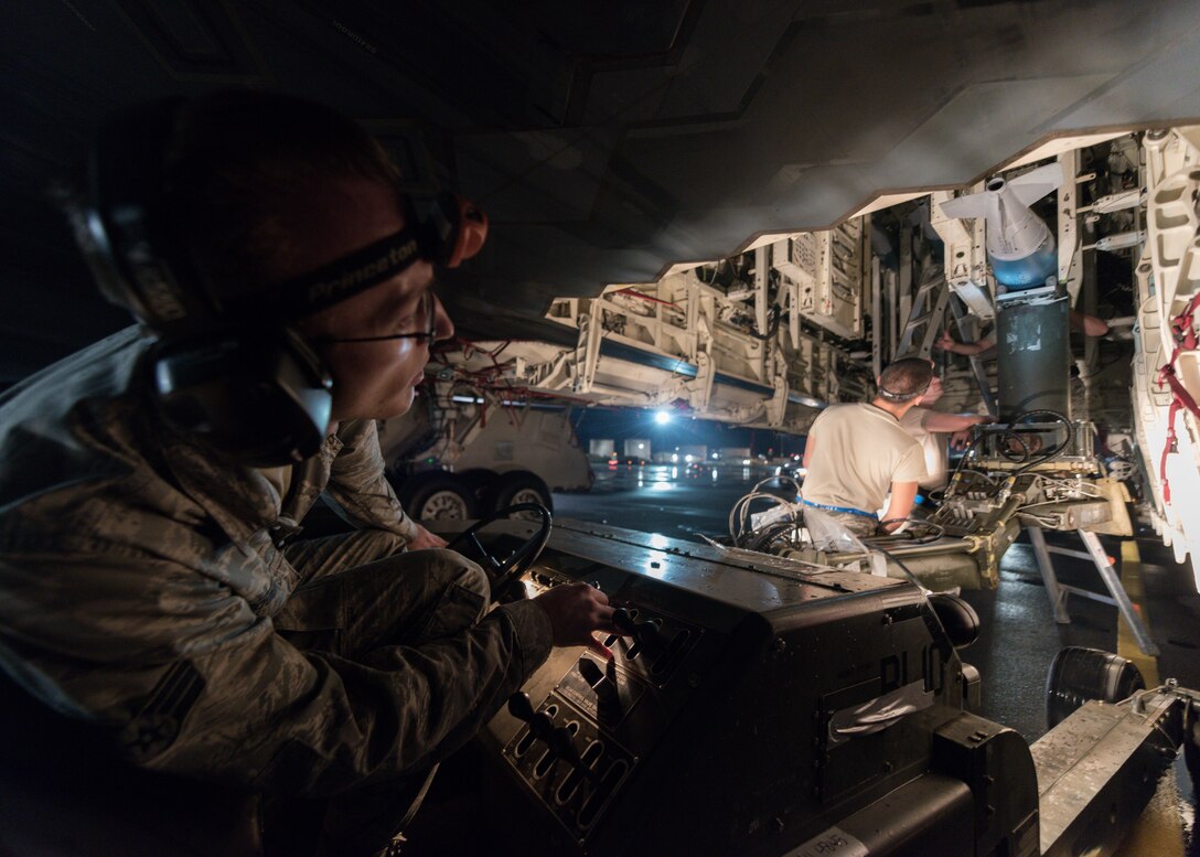 Senior Airman Michael C. Goodell, 509th Munitions Squadron weapons maintenance, prepares a B-2 Spirit bomber, deployed from Whiteman Air Force Base, Missouri, for a training mission at Joint Base Pearl Harbor-Hickam, Hawaii, Jan. 17, 2019.