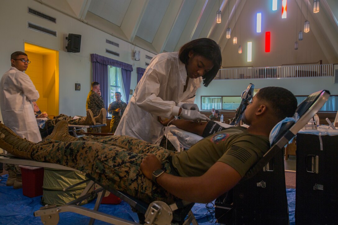 Cpl. Etrice Sawyer, an ammunition technician, with Combat Logistics Battalion 31, 31st Marine Expeditionary Unit, volunteers to give blood during a blood drive at Camp Hansen, Okinawa, Japan, Jan. 14, 2019. Marines were encouraged to donate blood for the upcoming exercise Cobra Gold. The 31st MEU, the Marine Corps’ only continually forward-deployed MEU, provides a flexible force ready to perform a wide range of military operations as the premier crisis response force in the Indo-Pacific region. (U.S. Marine Corps photos by Lance Cpl. Cameron Parks/ Released)