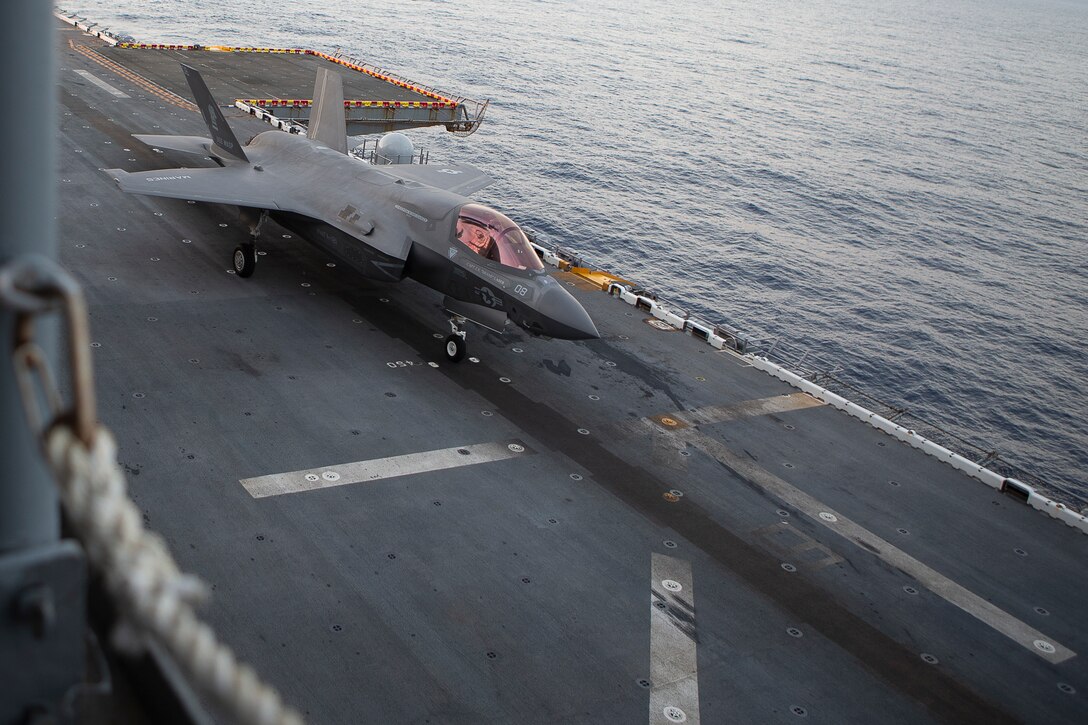 An F-35B Lightning II belonging to Marine Fighter Attack Squadron 121 sits ready for launch aboard the amphibious assault ship USS Wasp (LHD 1) during training at sea, Jan. 19, 2019. Naval aviators with VMFA-121, 31st Marine Expeditionary Unit's Aviation Combat Element, conduct take-off and landings during fixed-wing flight operations in the Marine Corps' newest, most advanced multi-role fighter, the F-35B. The 31st MEU, the Marine Corps’ only continuously forward-deployed MEU partnering with the Wasp Amphibious Ready Group, provides a flexible and lethal force ready to perform a wide range of military operations as the premier crisis response force in the Indo-Pacific region. (U.S. Marine Corps photo by Gunnery Sgt. T. T. Parish/Released)