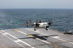 U.S. Navy file photo of a C-2A Greyhound as it lands on the flight deck of a Nimitz-class aircraft carrier.