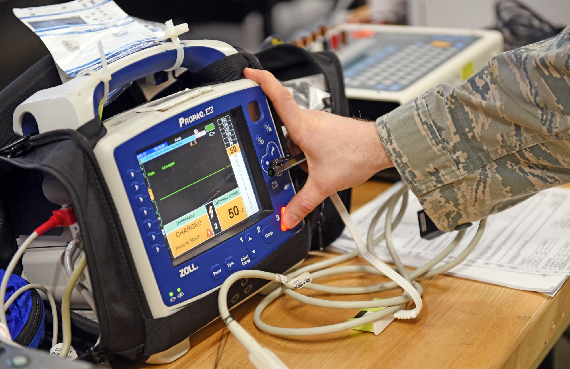 Airman 1st Class Jason McGhee, 375th Medical Support Squadron biomedical equipment technician, calibrates a patient monitor and defibrillator at the 375th Medical group Clinic, Scott Air Force Base, Ill. Jan. 11, 2019. As a member of the 375th Medical Equipment Repair Center, McGhee ensures equipment is calibrated and properly set up in efforts to take care of patients when they come into the hospital, ensuring the equipment serves its purpose. (Air Force photo by Airman 1st Class Chad Gorecki)