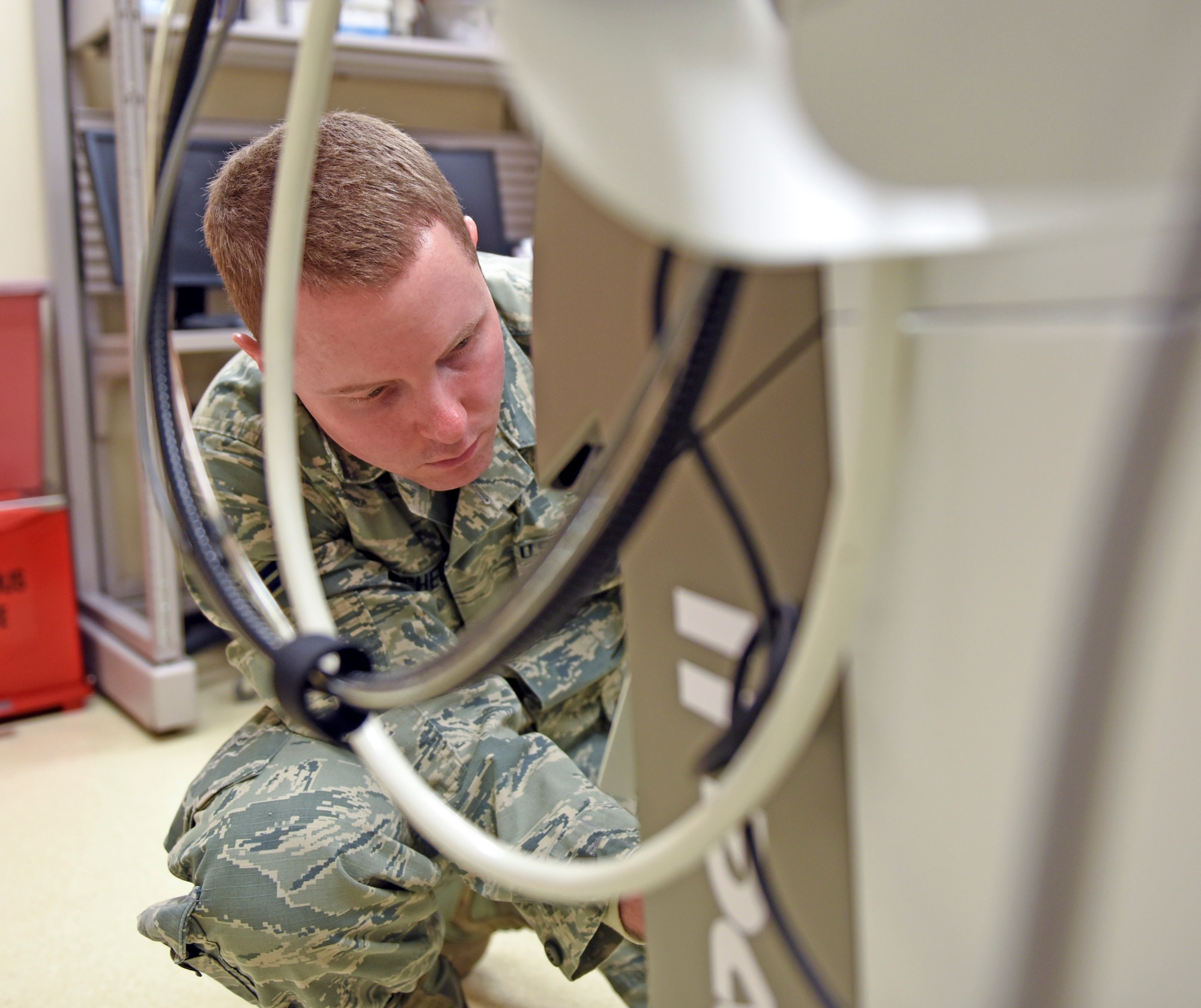 Airman 1st Class Jason McGhee, 375th Medical Support Squadron biomedical equipment technician, repairs a dermatologic laser at the 375th Medical group Clinic, Scott Air Force Base, Ill. Jan. 11, 2019. As a member of the 375th Medical Equipment Repair Center, McGhee ensures vital equipment including patient movement items such as ventilators, infant incubators, life support units, defibrillators and patient monitors are calibrated and properly set up.(Air Force photo by Airman 1st Class Chad Gorecki)