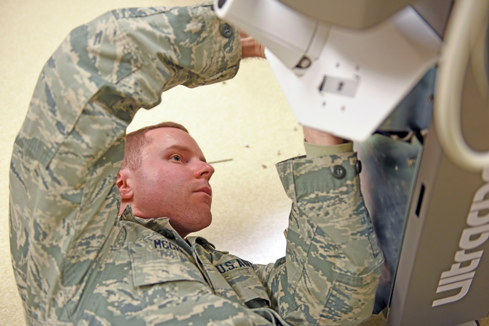 Airman 1st Class Jason McGhee, 375th Medical Support Squadron biomedical equipment technician, repairs a dermatologic laser at the 375th Medical group Clinic, Scott Air Force Base, Ill. Jan. 11, 2019. Without the 375th Medical Equipment Repair Center being at Scott, the base would have to rely on contractors or other bases to maintain the equipment, which could lengthen the process by weeks. (Air Force photo by Airman 1st Class Chad Gorecki)