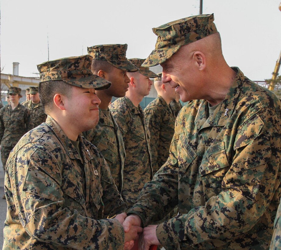CAMP HUMPHREYS, Republic of Korea – Capt. Inchul Ha, U.S. Marine Corps Forces Korea logistics planner, receives the Navy and Marine Corps Achievement Medal from Maj. Gen. Patrick J. Hermesmann, MARFORK commander, here, Jan. 22. Ha helped orient and align the command’s logistics focus to set the force for all Marines Corps forces in Korea. (Official U.S. Marine Corps photos by Sgt. Nathaniel Hanscom/Released)