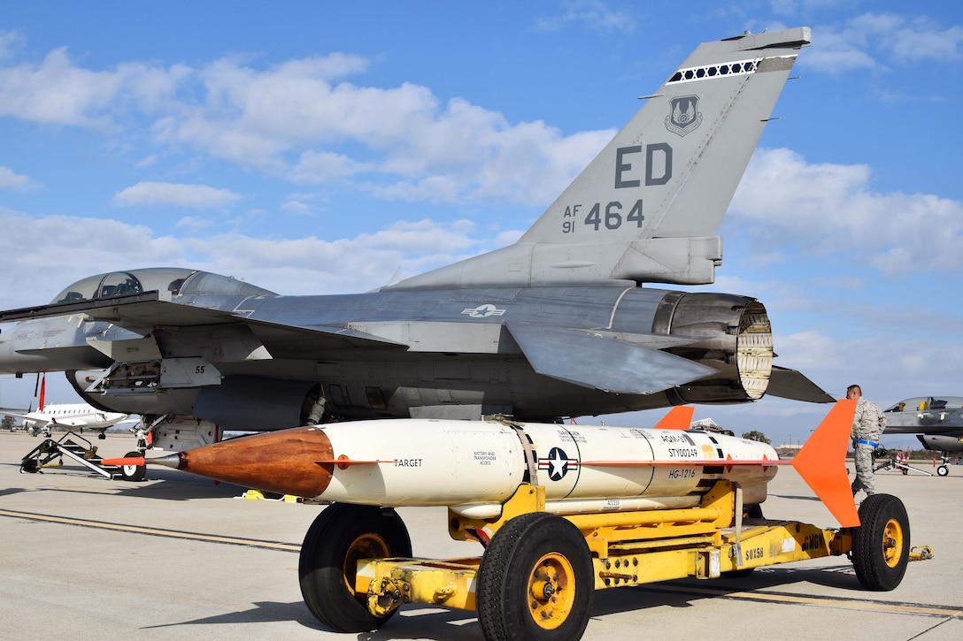An Edwards Air Force Base F-16 sits at Naval Air Station Point Mugu, California, along with an AQM-37D supersonic target, Nov. 28, 2018. Two F-16s and maintenance Airmen from Edwards assisted the U.S. Navy and Royal Australian Navy with a test of a RAN ship’s combat system late last year. (U.S. Navy photo by BU3 Dakota Fink)