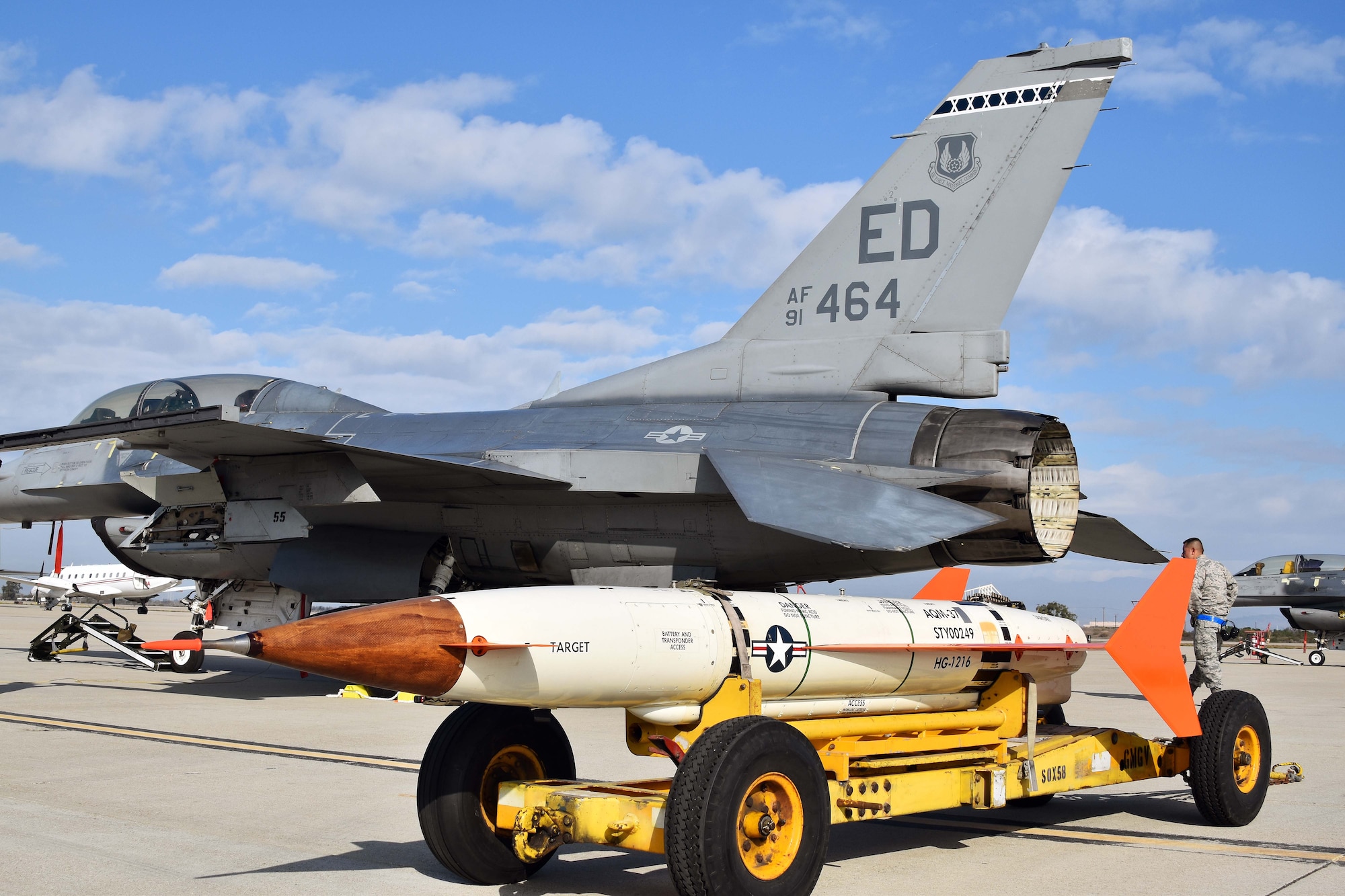 An Edwards Air Force Base F-16 sits at Naval Air Station Point Mugu, California, along with an AQM-37D supersonic target, Nov. 28, 2018. Two F-16s and maintenance Airmen from Edwards assisted the U.S. Navy and Royal Australian Navy with a test of a RAN ship’s combat system late last year. (U.S. Navy photo by BU3 Dakota Fink)