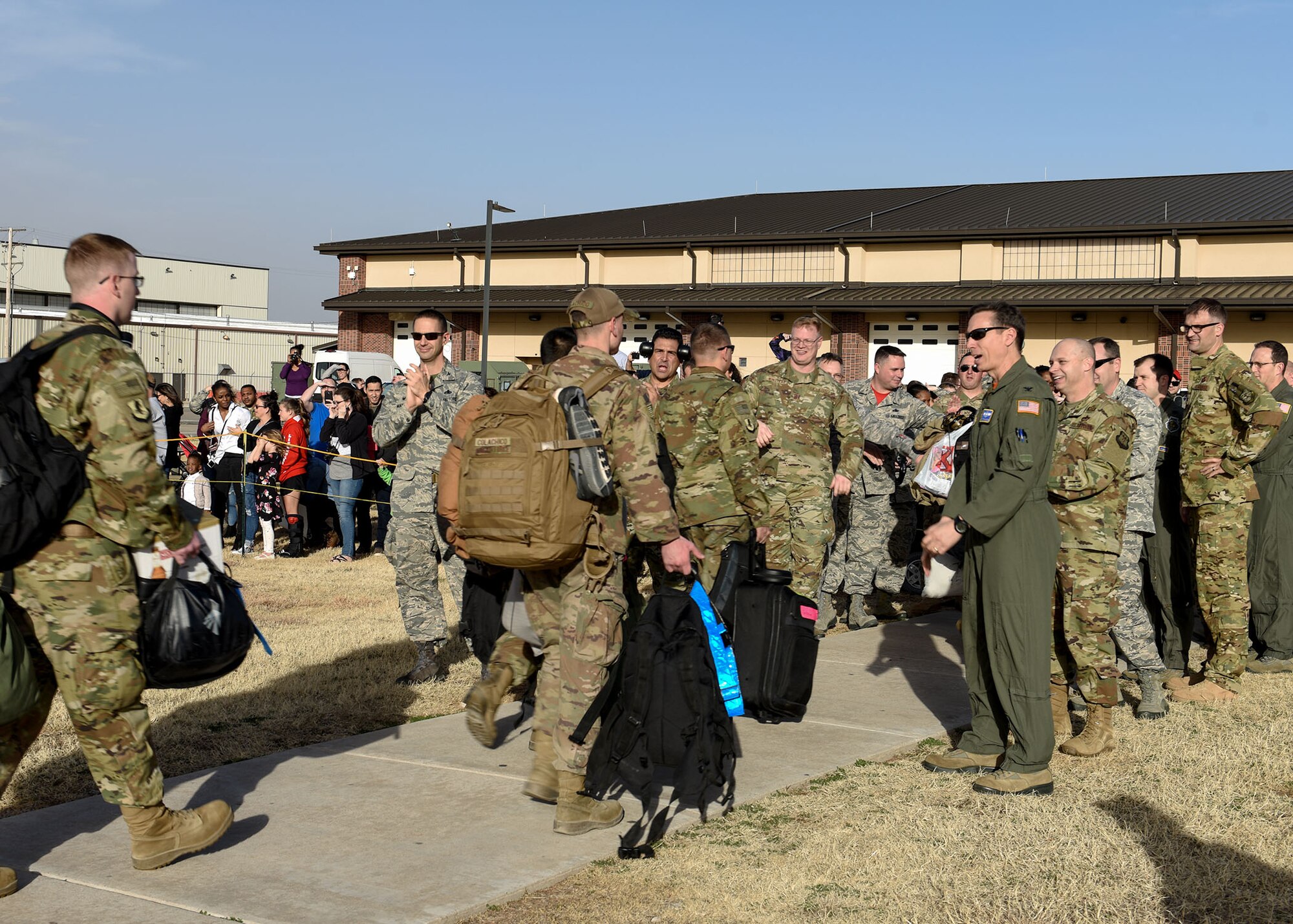 317th AW Airmen return home, embrace their families