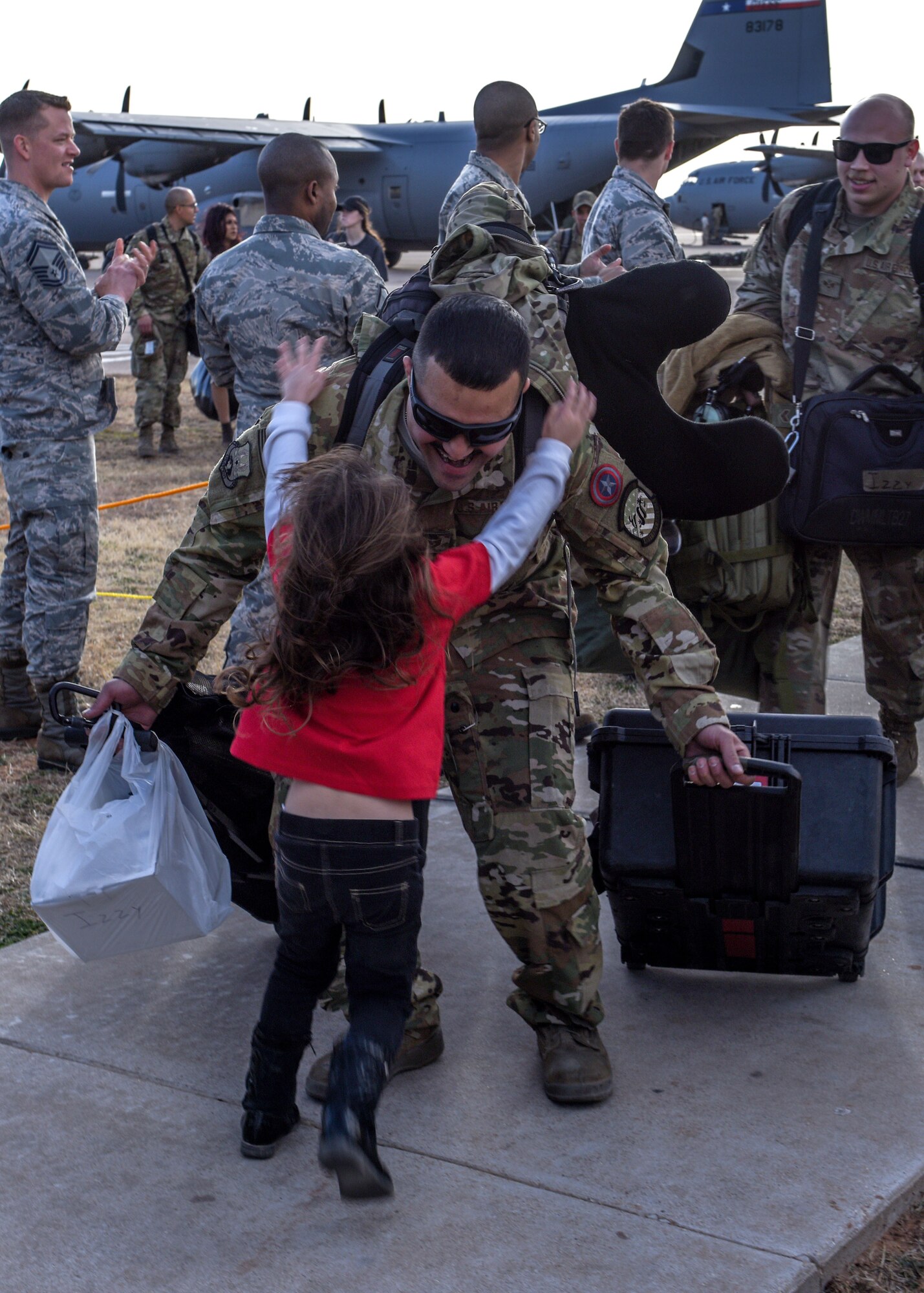 317th AW Airmen return home, embrace their families