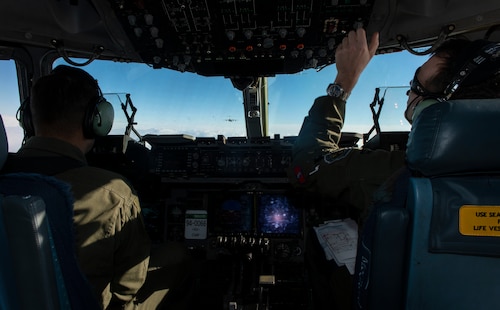 Capt. Kyle Brackett and Capt. Jason Sewell, C-17 Globemaster III pilots assigned to the 58th Airlift Squadron, follow behind another C-17 during the Altus Quarterly Exercise (ALTEX), Jan. 22, 2019, at Altus Air Force Base, Okla.