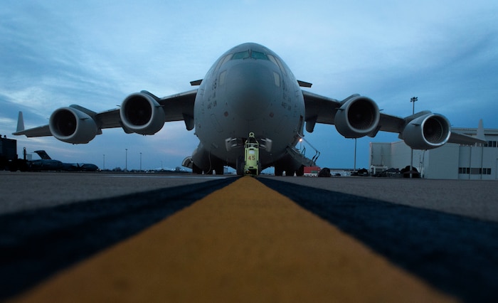 A C-17 Globemaster III gets checked to make sure it is ready to fly during the Altus Quarterly Exercise (ALTEX), Jan. 22, 2019, at Altus Air Force Base, Okla.