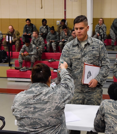 Airman 1st Class Maxwell Drimmer, 628th Logistics Readiness Squadron supply apprentice, is in-processed during a pre-deployment function line exercise Jan. 23, 2019 at Joint Base Charleston-Weapons Station, S.C.