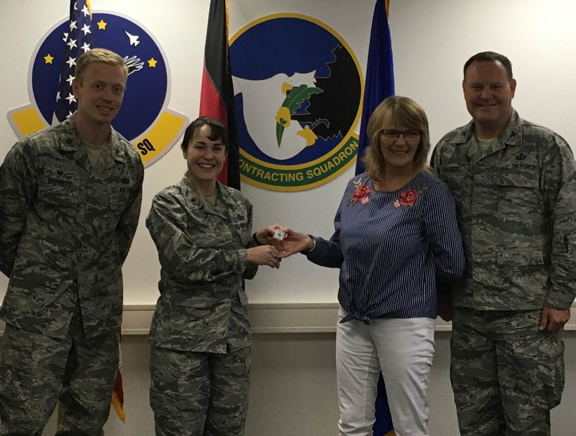 At center, Brig. Gen. Alice Trevino, Air Force Installation Contracting Agency, recognizes Katharina Hafner, a member of the 52nd Contracting Squadron, with a change agent pin as part of AFICA’s change agent program. Trevino presented the pin during her visit to Spangdahlem Air Base, Germany. (U.S. Air Force photo)