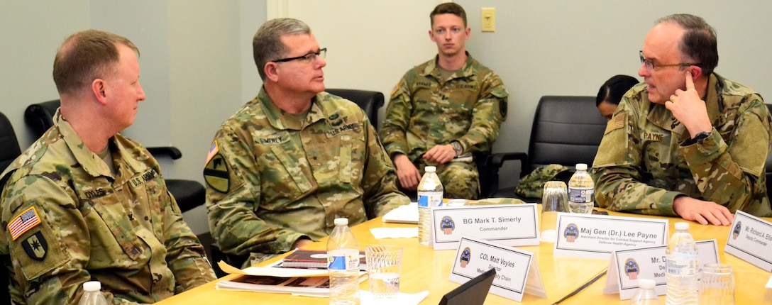 Air Force Maj. Gen. Lee Payne, DHA’s Combat Support Agency assistant director, right, talks with Army Brig. Gen. Mark Simerly, DLA Troop Support commander, center, and Army Col. Matthew Voyles, Medical supply chain director, left, during a visit Jan. 11, 2019 in Philadelphia.