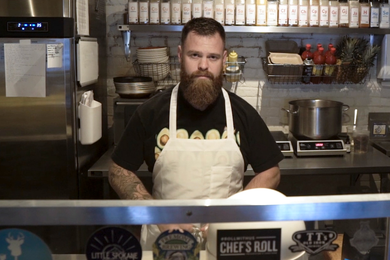 Chef stands in restaurant kitchen
