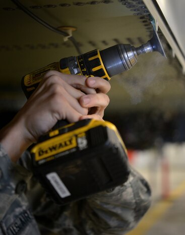 Airman 1st Class Gregory Hill, 9th Maintenance Squadron aircraft structural maintenance technician, shapes a part on an RQ-4 Global Hawk