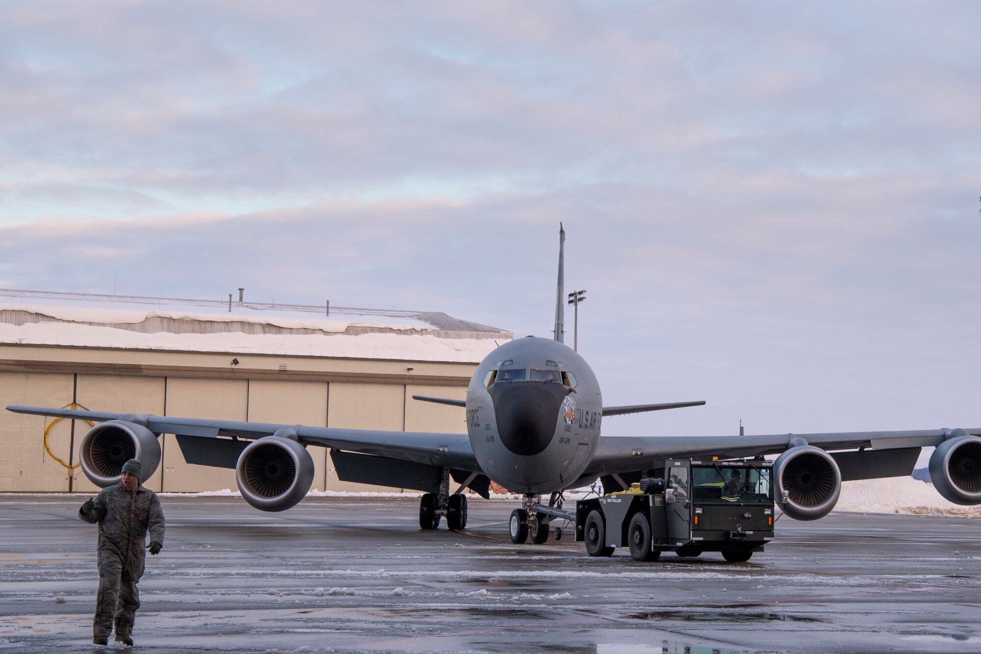 A KC-135R Stratotanker is taxed into a dock at Grissom Air Reserve Base, Indiana, Jan. 13, 2018. Team Grissom rallied to help get 18 deployers home on time despite weather and mechanical obstacles. (U.S. Air Force photo/Master Sgt. Ben Mota)