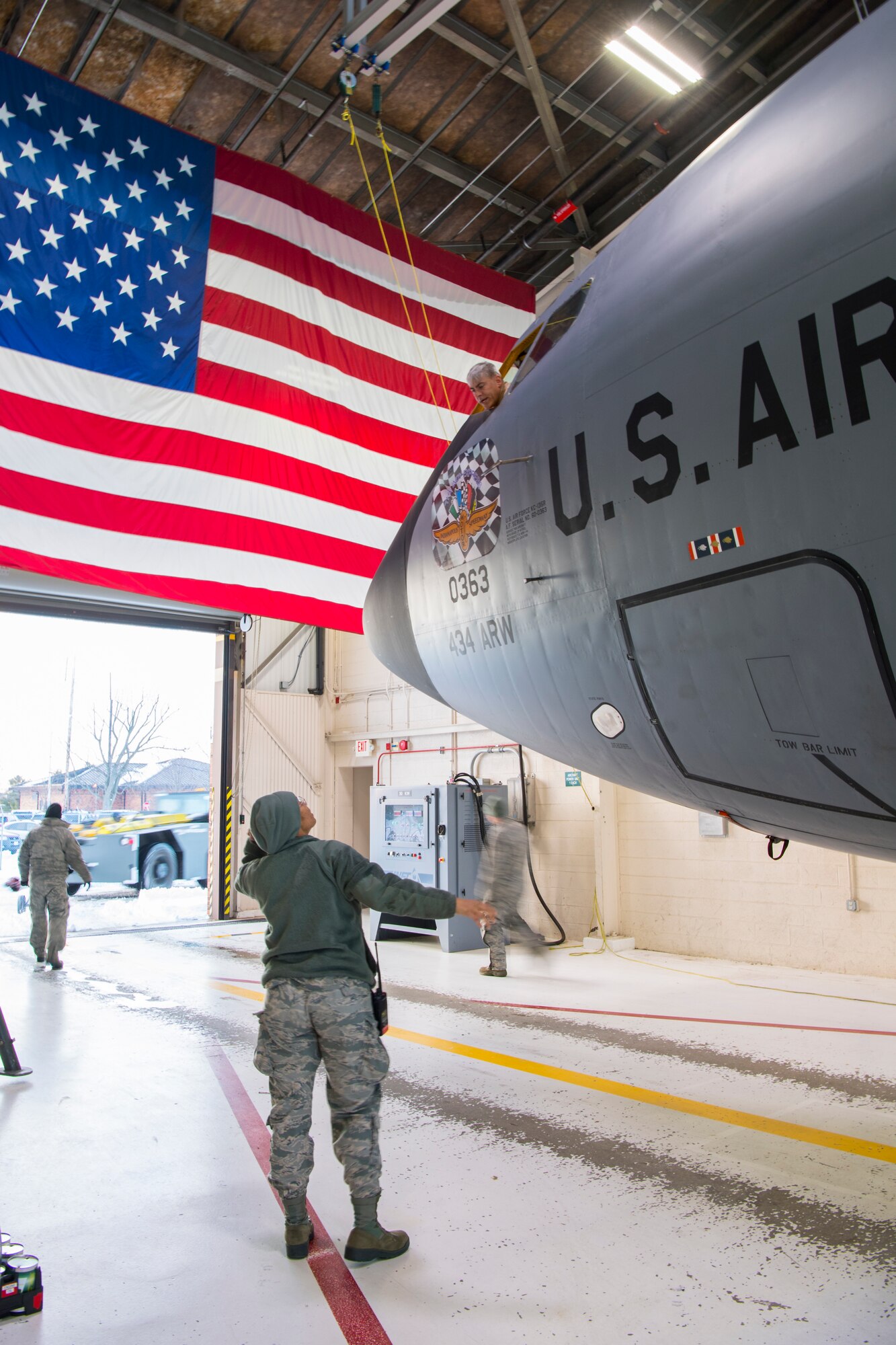 Tech. Sgt. Julia Person, 434th Aircraft Maintenance Squadron KC-135R Stratotanker crew chief, speaks with Lt. Col. Douglas Perry, 434th Operations Support Squadron KC-135 pilot, shortly after their aircraft was taxied into a dock at Grissom Air Reserve Base, Indiana, Jan. 13, 2018. Team Grissom rallied to help get 18 deployers home on time despite weather and mechanical obstacles. (U.S. Air Force photo/Master Sgt. Ben Mota)