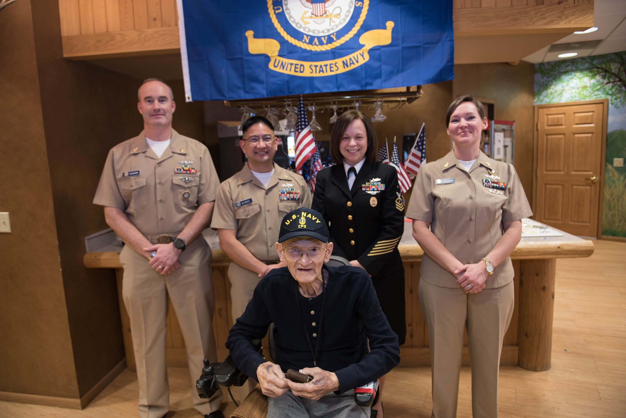 Navy veteran Chief Petty Officer Leonard Kulceski poses for a photo with chief petty officers from the U.S. Strategic Command Navy Element during a veteran recognition ceremony at Hillcrest Mable Rose in Papillion, Nebraska, Jan. 18, 2019. Kulceski was in the Cavite Navy Yard, the second place to be bombed during World War II. (U.S. Air Force photo by Zachary Hada)