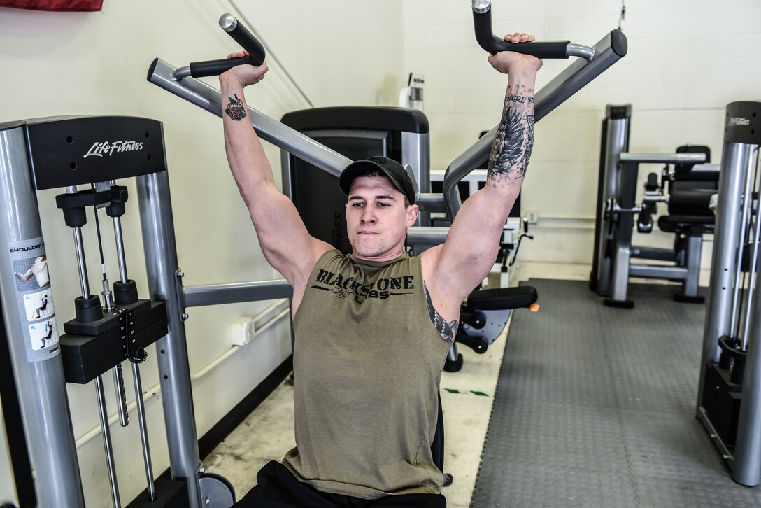 Staff Sgt. Adam Pipp, an aerospace ground equipment journeyman assigned to the 115th Maintenance Group, Truax Field, Wisconsin, exercises in the base fitness center Jan. 24, 2019. (U.S. Air National Guard photo by Tech. Sgt. Mary E. Greenwood)