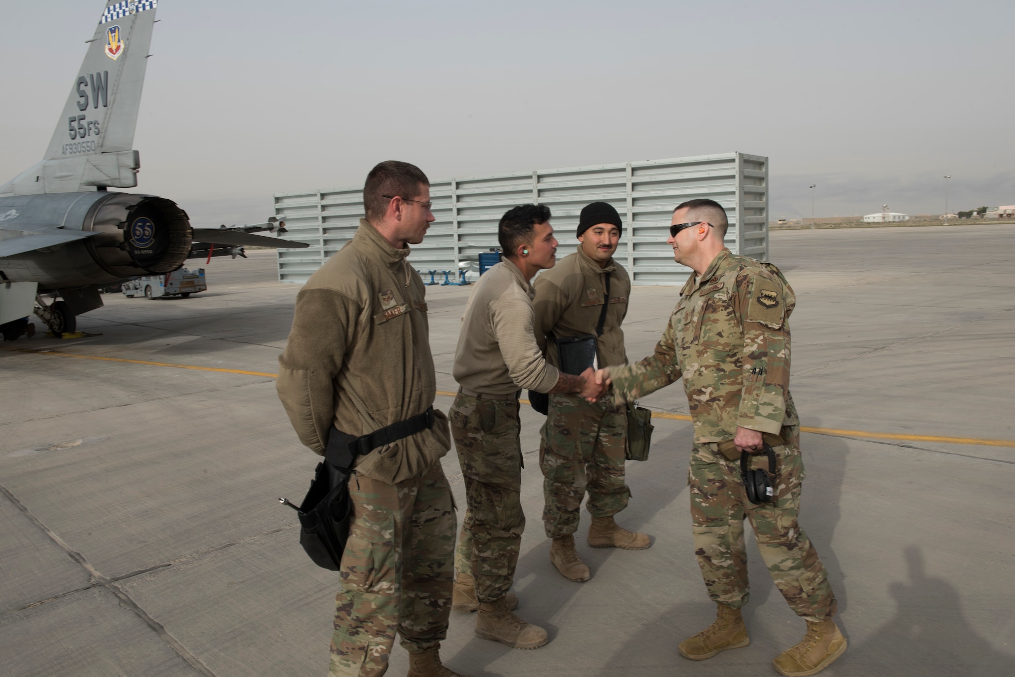 332 AEW command chief greets 407 AEG Airmen