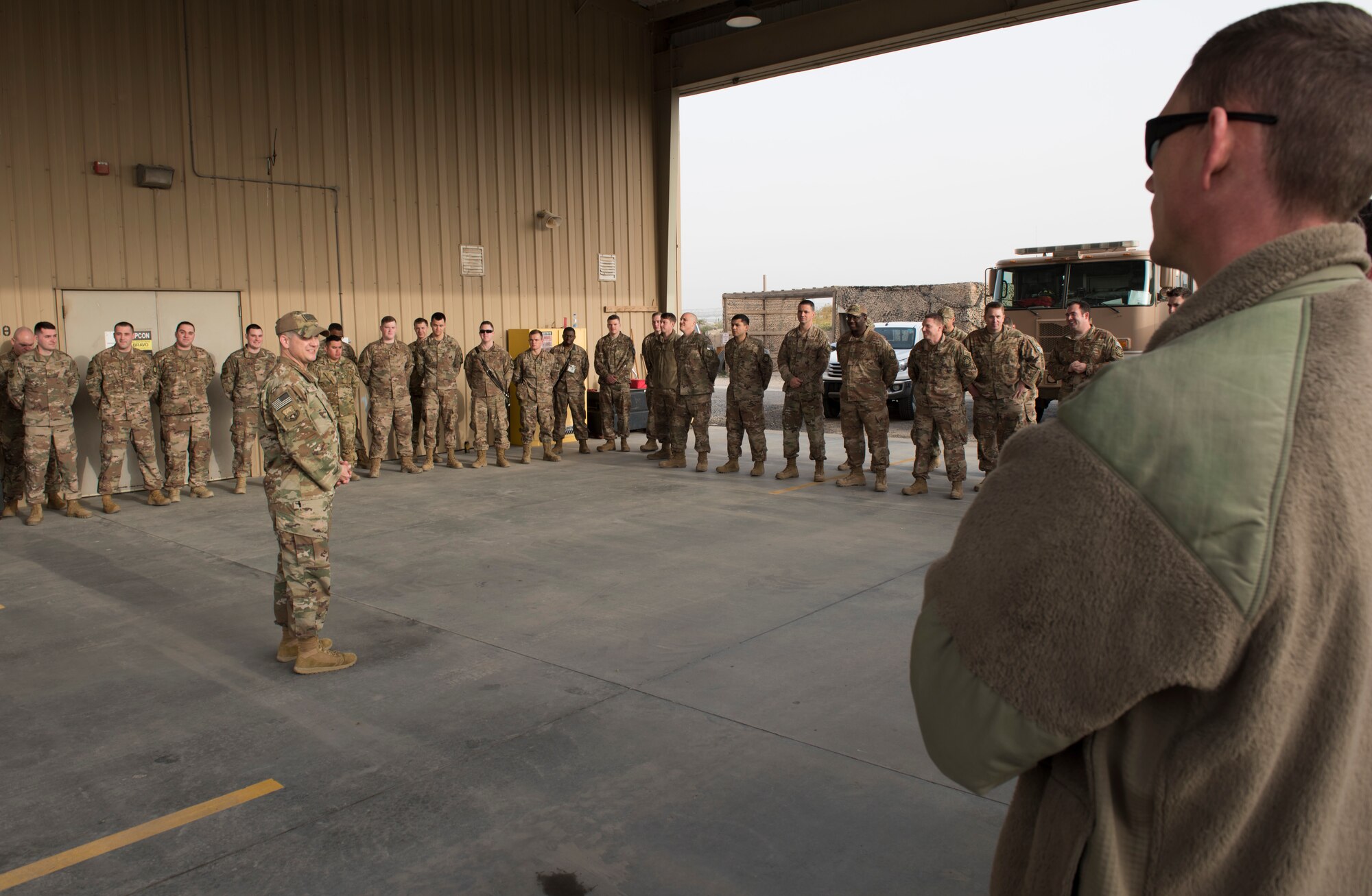 332 AEW command chief greets 407 AEG Airmen