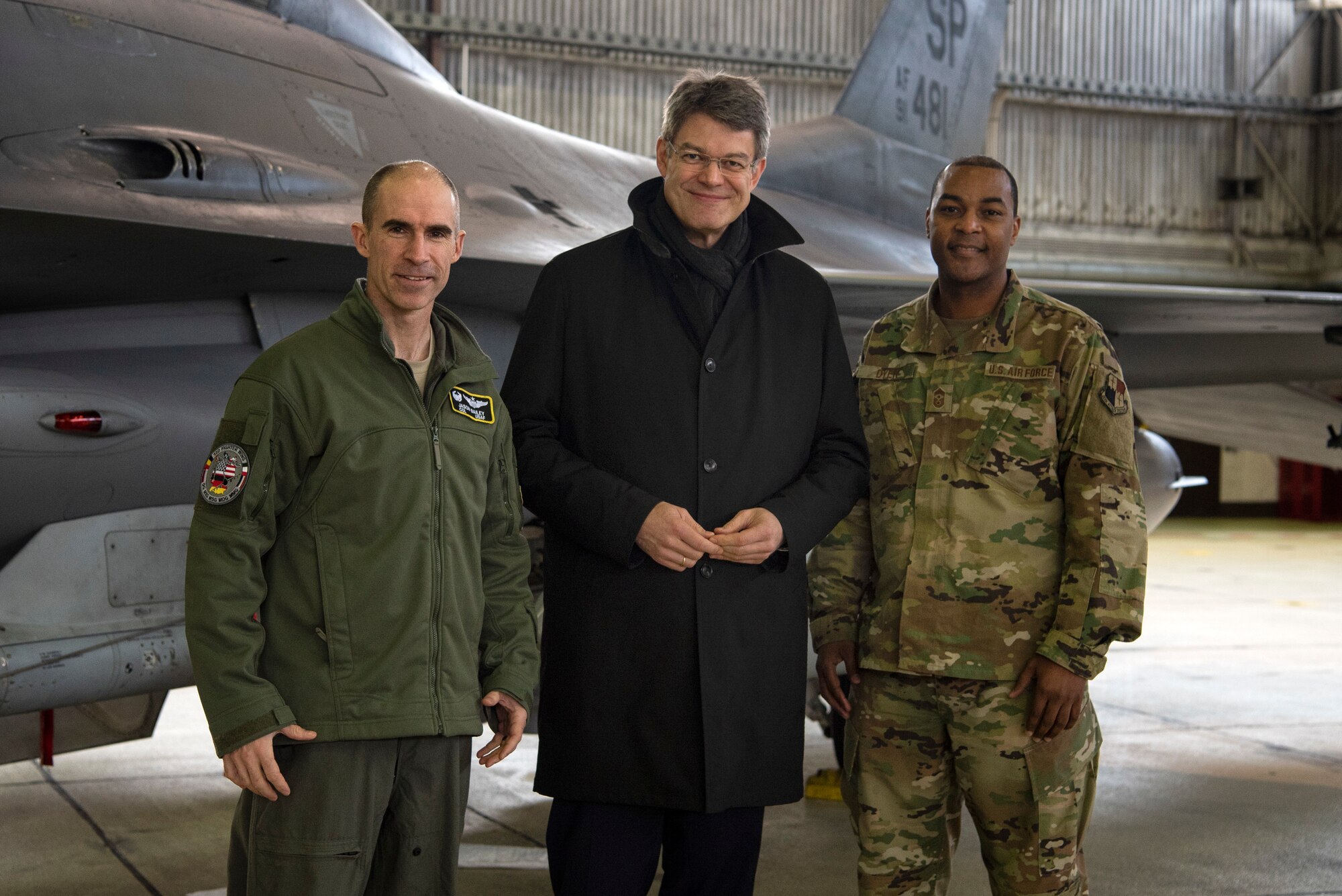 U.S. Air Force Col. Jason Bailey, 52nd Fighter Wing commander, left, and Chief Master Sgt. Alvin Dyer, 52nd FW command chief, right, welcome Patrick Schnieder, member of the German Federal Parliament in Berlin, center, to Spangdahlem Air Base, Germany, Jan. 24, 2019. Schnieder represents the county of Bitburg, Germany, for the Christian Democratic Union. The visit gave Schnieder an opportunity to learn about base functions. (U.S. Air Force photo by Airman 1st Class Valerie Seelye)