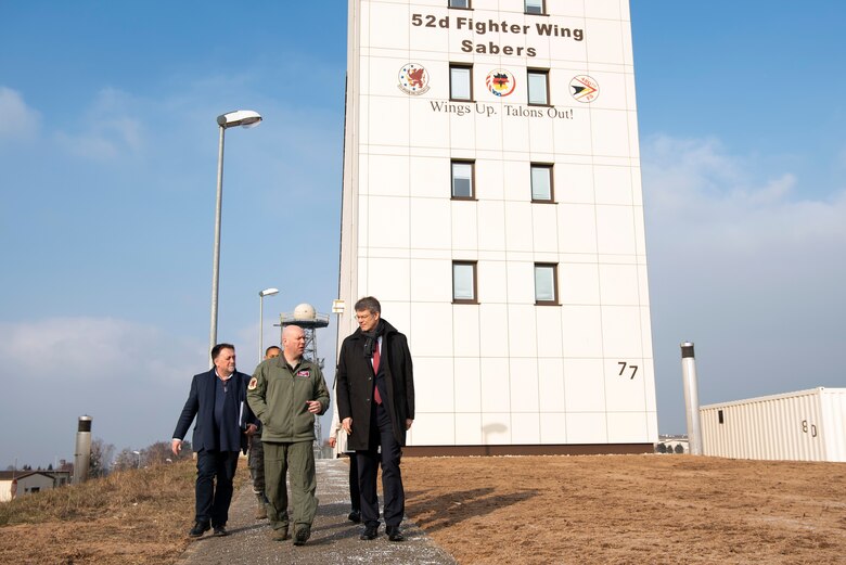 Patrick Schnieder, member of the German Federal Parliament in Berlin, right, tours the air traffic control tower with members of the 52nd Fighter Wing at Spangdahlem Air Base, Germany, Jan. 24, 2019. Distinguished visitor tours help maintain a good relationship between military forces and the local community. (U.S. Air Force photo by Airman 1st Class Valerie Seelye)