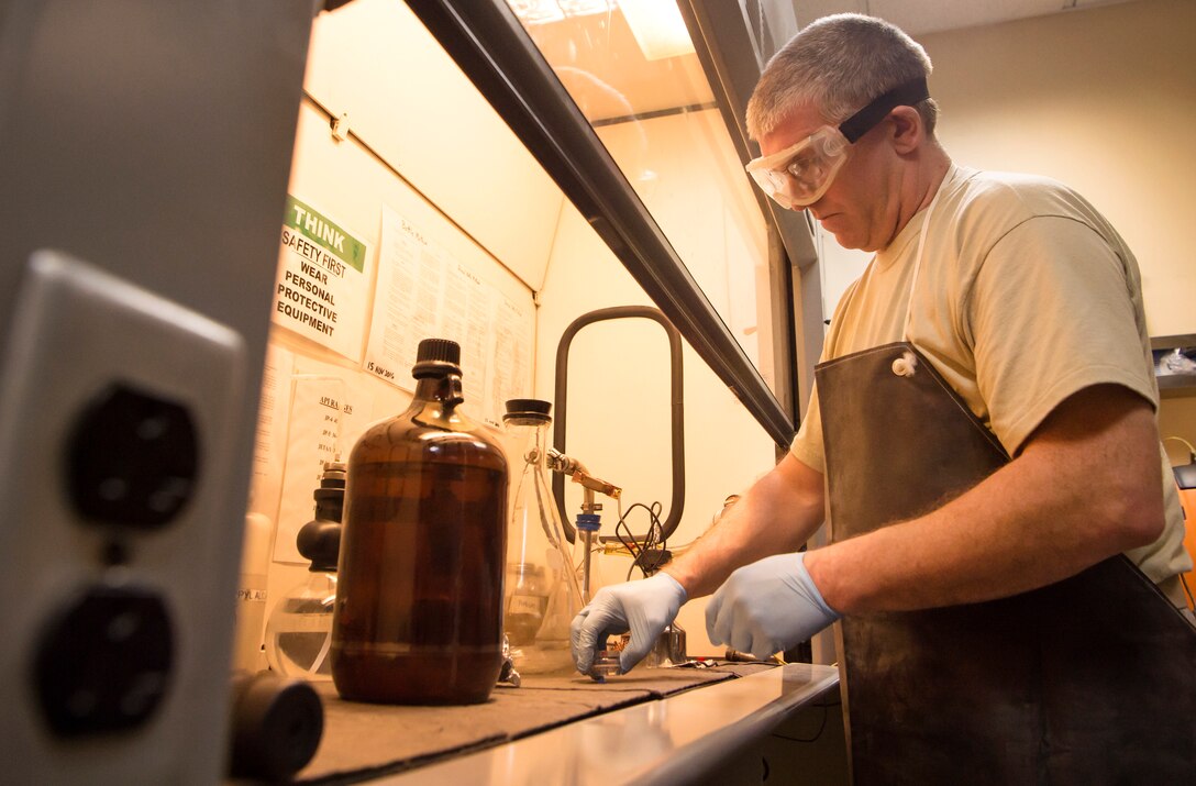 Tech. Sgt. Steven Jenkins, 379th Expeditionary Logistics Readiness Squadron (ELRS) fuels lab NCO in charge, begins a ‘bottle method’ as part of a fuel inspection Jan. 24, 2019, at Al Udeid Air Base, Qatar. As part of his job, Jenkins analyzes various fuel types including gasoline, diesel fuel and Jet Propellant 8, to ensure they are free of contaminants before use in aircraft and vehicles. Airmen from the 379th ELRS fuel lab retrieve samples for testing from various sources including pipelines, trucks and fuel tanks.   (U.S. Air Force photo by Tech. Sgt. Christopher Hubenthal)