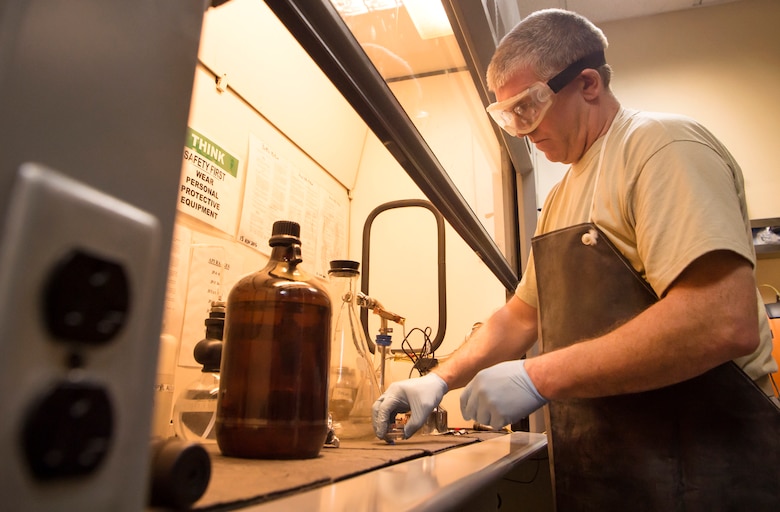 Tech. Sgt. Steven Jenkins, 379th Expeditionary Logistics Readiness Squadron (ELRS) fuels lab NCO in charge, begins a ‘bottle method’ as part of a fuel inspection Jan. 24, 2019, at Al Udeid Air Base, Qatar. As part of his job, Jenkins analyzes various fuel types including gasoline, diesel fuel and Jet Propellant 8, to ensure they are free of contaminants before use in aircraft and vehicles. Airmen from the 379th ELRS fuel lab retrieve samples for testing from various sources including pipelines, trucks and fuel tanks.   (U.S. Air Force photo by Tech. Sgt. Christopher Hubenthal)