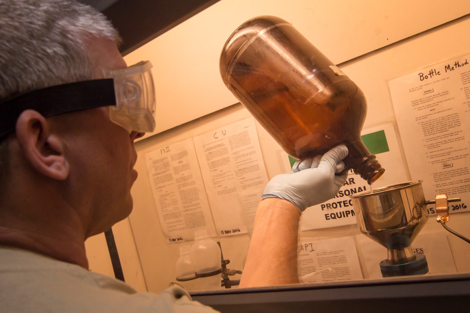 Tech. Sgt. Steven Jenkins, 379th Expeditionary Logistics Readiness Squadron (ELRS) fuels lab NCO in charge, performs a ‘bottle method’ during fuel testing Jan. 24, 2019, at Al Udeid Air Base, Qatar. As part of his job, Jenkins analyzes various fuel types including gasoline, diesel fuel and Jet Propellant 8, to ensure they are free of contaminants before use in aircraft and vehicles. Airmen from the 379th ELRS fuel lab retrieve samples for testing from various sources including pipelines, trucks and fuel tanks.   (U.S. Air Force photo by Tech. Sgt. Christopher Hubenthal) (U.S. Air Force photo by Tech. Sgt. Christopher Hubenthal)