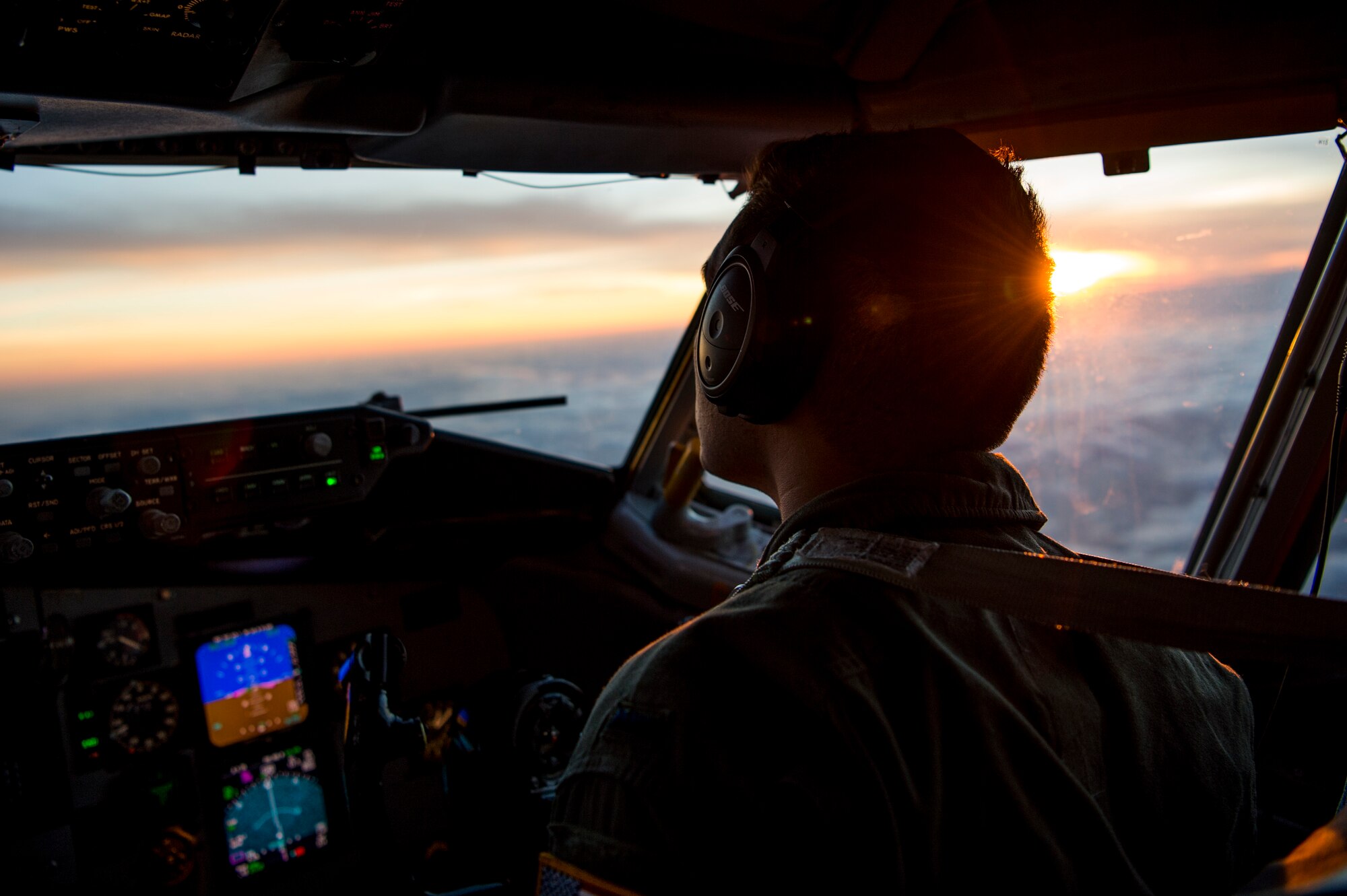 U.S. Air Force 1st Lt. Sean Thomas, a 91st Air Refueling Squadron KC-135 Stratotanker pilot, scans the evening horizon for the receiver aircraft during an aerial-refueling mission supporting Exercise Emerald Warrior, Jan. 17, 2019 over the Gulf of Mexico.
