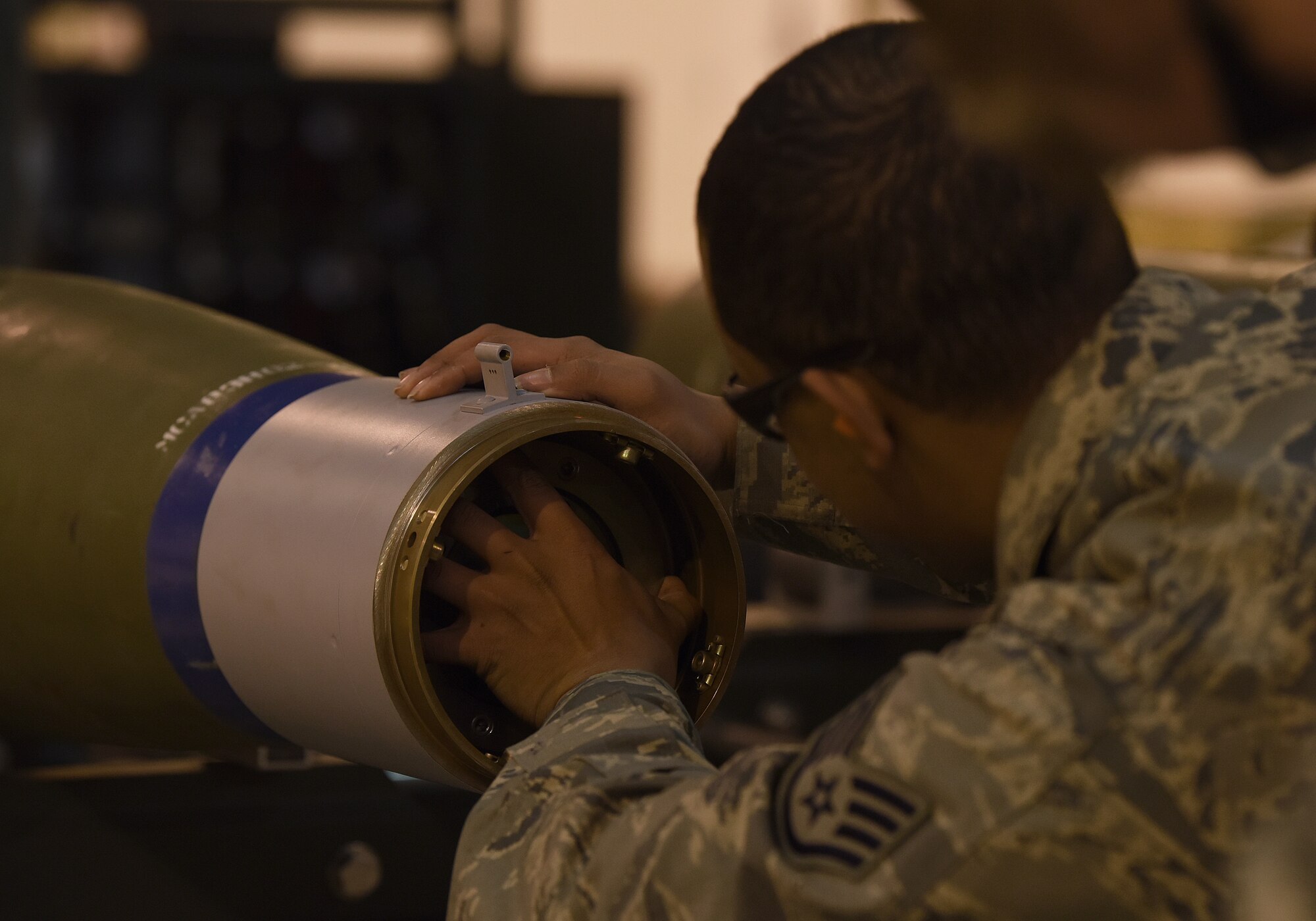 Staff Sgt. Deion Montana-Graham, 48th Munitions Squadron conventional maintenance supervisor, installs the front collar of an inert weapon at Royal Air Force Lakenheath, England, Jan. 23, 2019. The 48th MUNS team will be evaluated by a team from USAFE-AFAFRICA headquarters here Feb. 6.  (U.S. Air Force photo by Airman 1st Class Madeline Herzog)