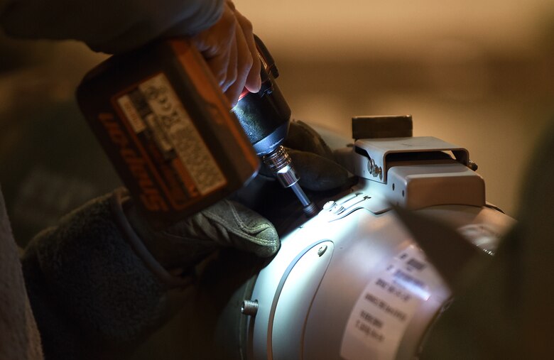 An Airman from the 48th Munitions Squadron drills parts on an inert weapon at Royal Air Force Lakenheath, England, Jan. 23, 2019. The squadron that wins the competition will get the opportunity to represent USAFE-AFAFRICA at Beale Air Force Base, California. (U.S. Air Force photo by Airman 1st Class Madeline Herzog)