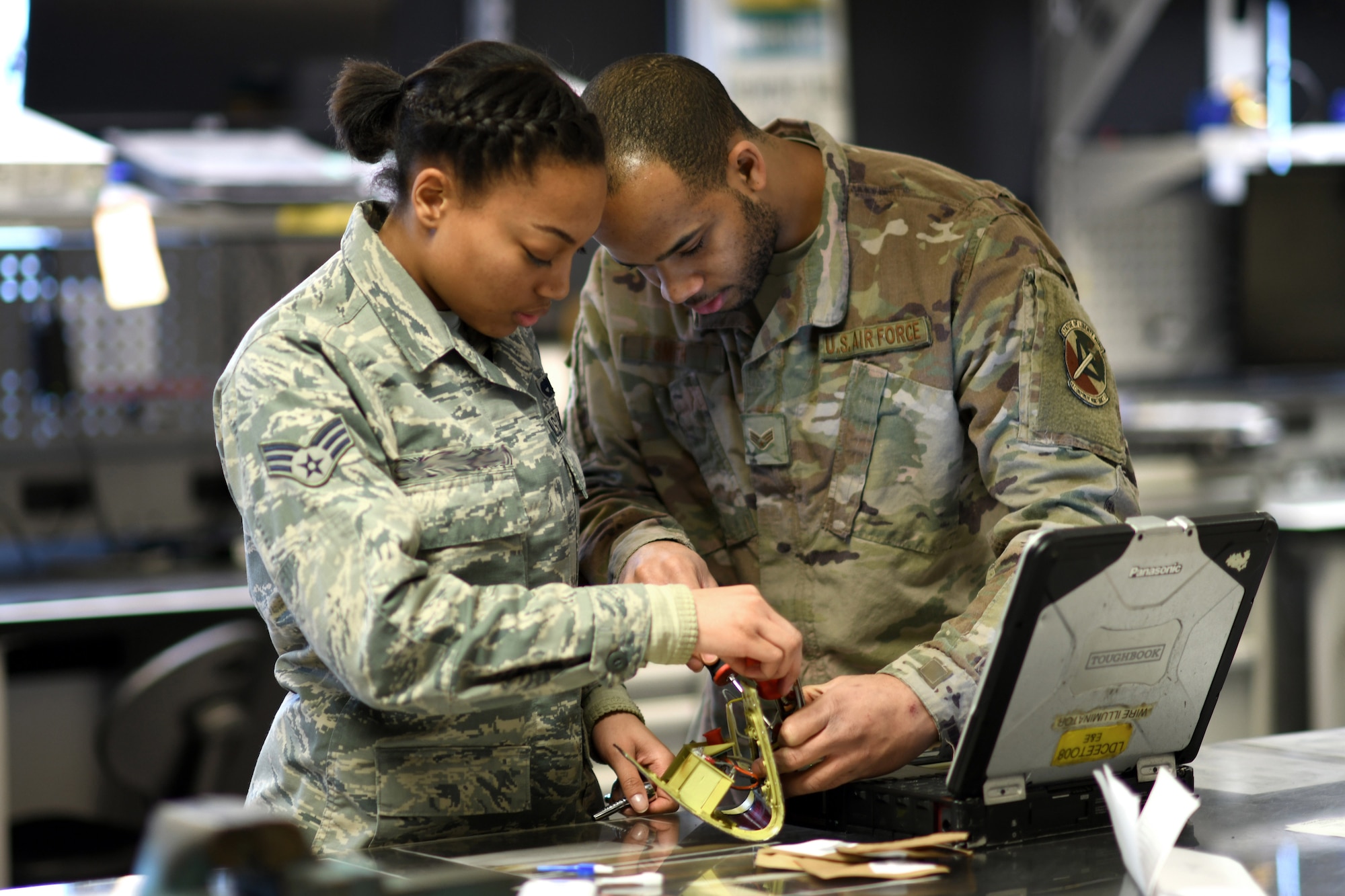 Airmen assigned to the 48th Component Maintenance Squadron’s Electrical and Environmental section repair an F-15’s wing tip light at Royal Air Force Lakenheath, England, Jan. 23, 2019. Throughout the month, several dozen components are broken down, repaired and reassembled by the backshop. (U.S. Air Force photo by Senior Airman Malcolm Mayfield)