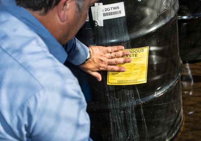 Robert Twineham, operations manager with Industrial Waste Utilization, labels hazardous waste drums at the Marine Wing Support Squadron-372 60 day hazardous material storage site at Marine Corps Base Camp Pendleton, California, Jan. 23, 2019. Twineham was preparing the hazardous waste for transport form the site to a waste management facility where it would be recycled.