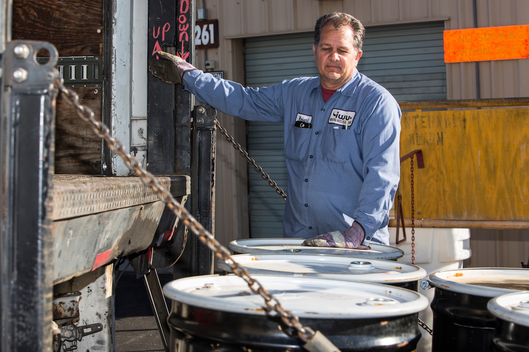 Robert Twineham, operations manager with Industrial Waste Utilization, loads drums of hazardous material waste onto a trunk at the Marine Wing Support Squadron-372 60 day HAZMAT storage site, Marine Corps Base Camp Pendleton, California, Jan. 23, 2019. Twineham was transporting the hazardous waste from the site to a waste management facitlity where it would be recycled.