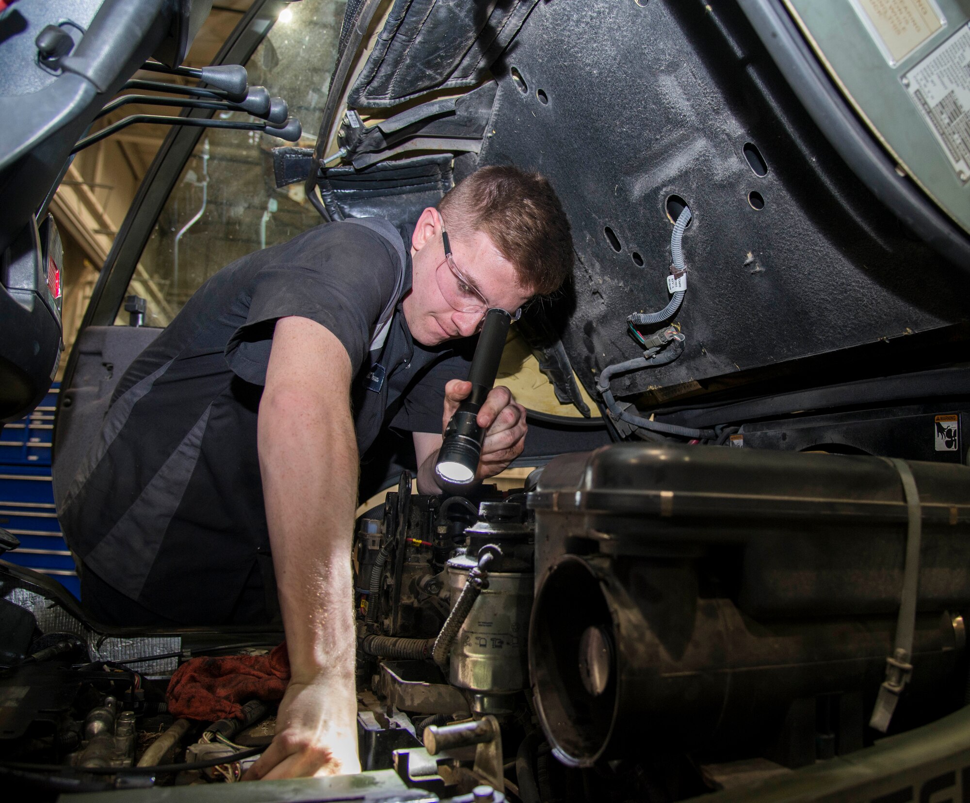 Airman 1st Class Aaron Turner, 375th Logistics Readiness Squadron vehicle maintenance technician, checks the oil on a forklift Jan. 10, 2019, at Scott Air Force Base, Ill. As vehicle maintenance Turner is trained to inspect, repair, and maintain the 326 vehicles that are needed for the daily mission at Scott.