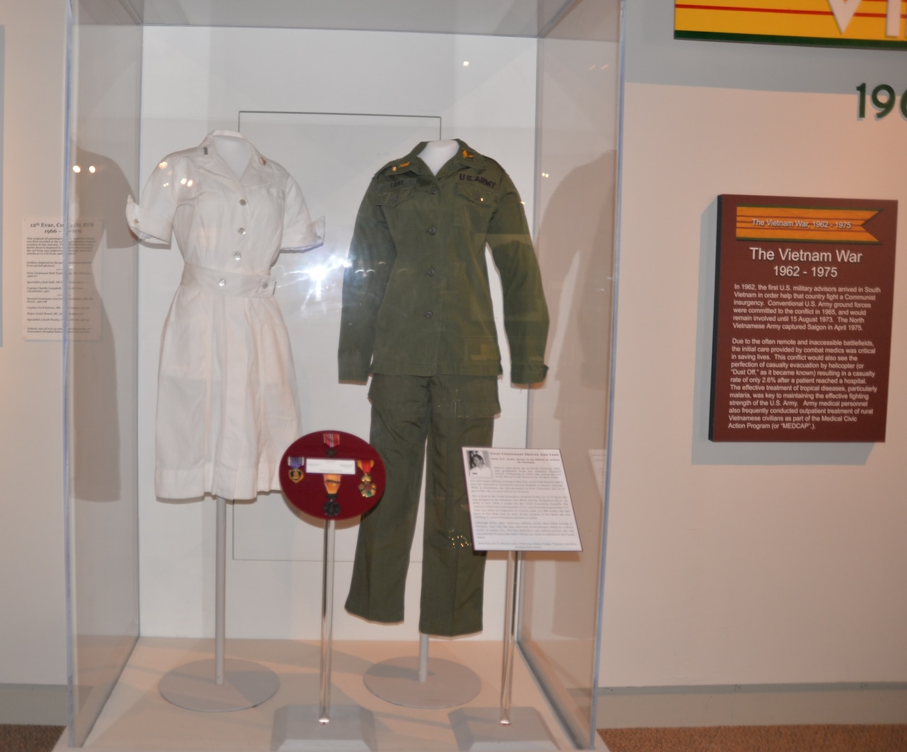 The duty dress and utility fatigue trousers and shirt worn by 1st Lt. Sharon Lane, a U.S. Army nurse who served in the Vietnam War, are included in a new exhibit about Lane recently installed at the U.S. Army Medical Department Museum at Joint Base San Antonio-Fort Sam Houston. Lane was killed in June 1969 at the 312th Evacuation Hospital in Chu Lai, South Vietnam from mortar and rocket fire directed at the hospital by Viet Cong forces. Other artifacts in the exhibit include the Bronze Star and Purple Heart medals awarded to her posthumously, and interpretative signage about Lane’s life, service and death. Lane was the only U.S. military nurse killed by enemy fire during the Vietnam War.
