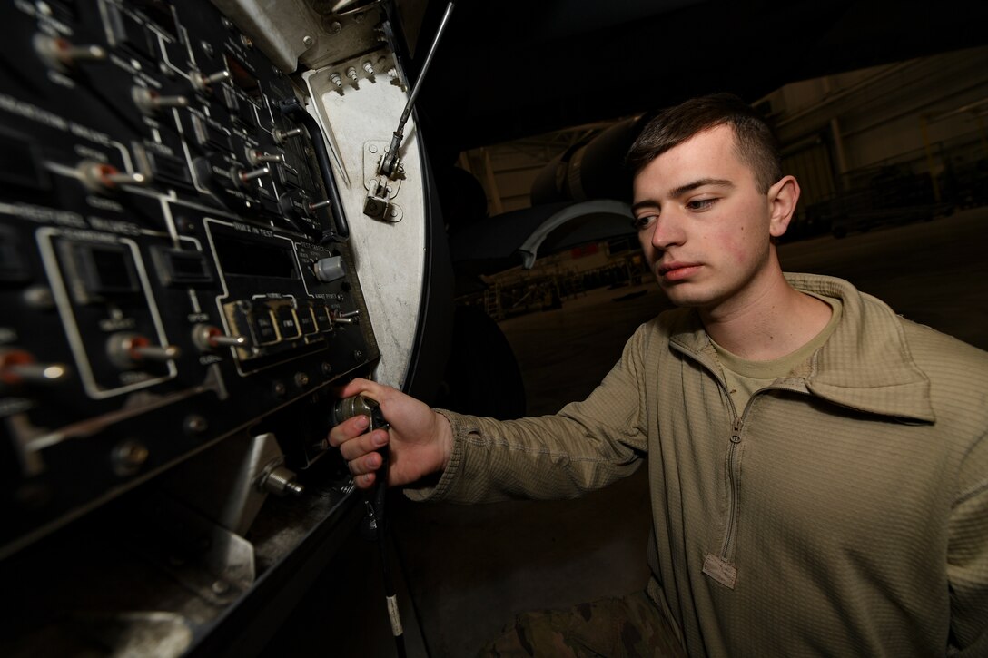 Senior Airman Vincent Holmes, home station check technician with the 911th Maintenance Squadron, plugs a communication cable into a panel of a C-17 Globemaster III aircraft assigned to the 911th Airlift Wing at Wright-Patterson Air Force Base, Ohio, January 15, 2019. The C-17 aircraft assigned to the 911th AW are temporarily at Wright-Patterson AFB due to the 911th AW’s base conversion from the C-130 aircraft to the C-17 aircraft, requiring members of the 911th Maintenance Group to be away from their home station to work on the aircraft. (U.S. Air Force photo by Joshua J. Seybert)