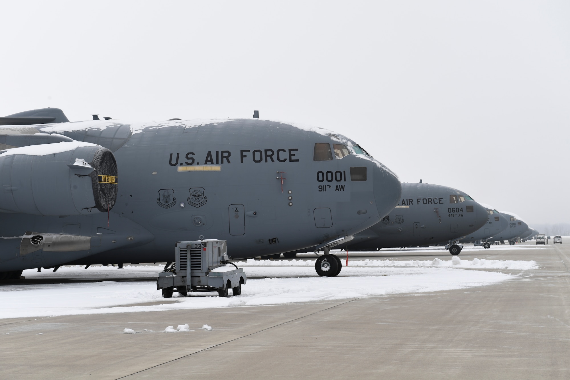 C-17 Globemaster III aircraft assigned to the 911th Airlift Wing and the 445th Airlift Wing sit on the flightline at Wright-Patterson Air Force Base, Ohio, January 15, 2019. The aircraft assigned to the 911th AW are temporarily at Wright-Patterson AFB due to the 911th AW’s base conversion from the C-130 aircraft to the C-17 aircraft, including the addition of a new hangar and changes to the flightline. (U.S. Air Force photo by Joshua J. Seybert)