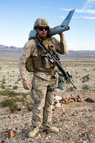 U.S. Marine Corps Pfc. Jacob Eckert, an intelligence specialist attached to 7th Marine Regiment, assembles the Unmanned Aircraft System RQ-20 PUMA during exercise Steel Knight (SK) 2019 at Marine Corps Air Ground Combat Center, Twentynine Palms, California, Dec 4. 28, 2018.