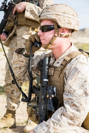 U.S. Marine Corps 1stLt. Sean Harper, Executive Officer with Headquarters Company, 7th Marine Regiment, communicates with Comabt Operations Center while on a detached reconnaissance patrol during exercise Steel Knight (SK) 2019 at Marine Corps Air Ground Combat Center, Twentynine Palms, California, Dec. 1, 2018.