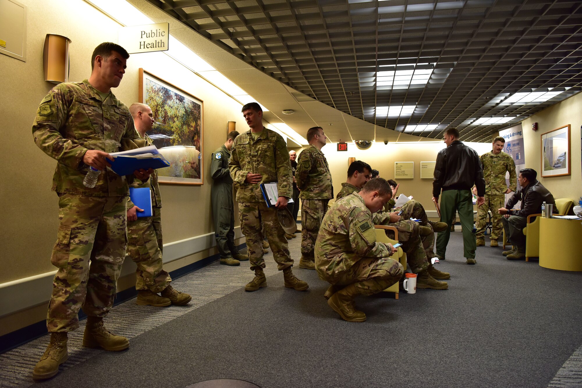 Airmen wait in line at the base clinic.