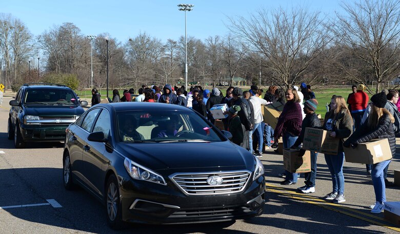 Volunteers put boxes of school supplies in teachers’ vehicles at the Columbus Soccer Field Complex Jan. 21, 2019, during Martin Luther King Jr. Day in Columbus, Mississippi. The volunteers are able to give back to over 700 teachers in the Columbus and Lowndes County area as a part of a national day of service on MLK Day. (U.S. Air Force photo by Airman Hannah Bean)