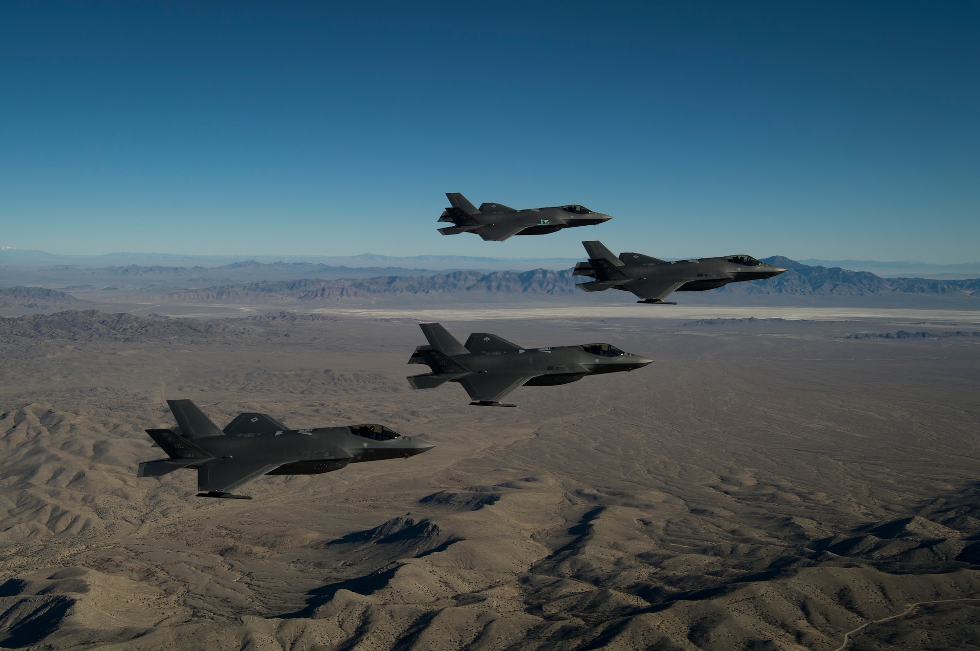 A formation of F-35A Lightning IIs, from the 388th and 419th Fighter Wings, fly over the Utah Test and Training Range. As the first combat-ready F-35 units in the Air Force, the 388th and 419th FW at Hill Air Force Base, Utah, are ready to deploy anywhere in the world at a moment's notice. (U.S. Air Force photo by Staff Sgt. Andrew Lee)