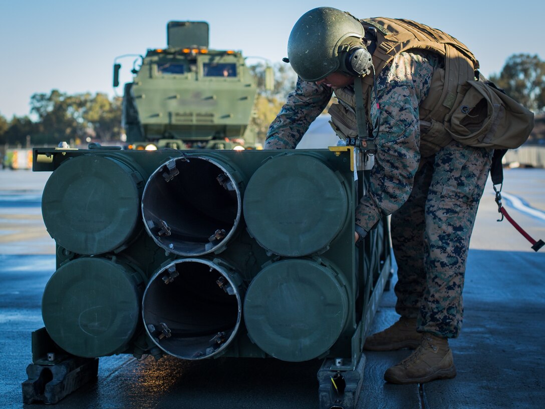 U.S. Marine Corps Staff Sgt. Shane Armstrong, an artillery cannon operator with 5th Battalion, 11th Marine Regiment, 1st Marine Division, checks a stack of M270 rockets during exercise Steel Knight (SK) 19 at Marine Corps Base Camp Pendleton, California, Dec. 7, 2018.