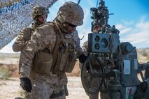 U.S. Marine Corps Sgt. Christian Gomezluna, a field artillery cannoneer with India Battery, 3rd Battalion, 11th Marine Regiment, 1st Marine Division, adjusts a M777 Howitzer, during exercise Steel Knight (SK) 2019 at Marine Corps Air Ground Combat Center, Twentynine Palms, California, Dec. 4, 2018.