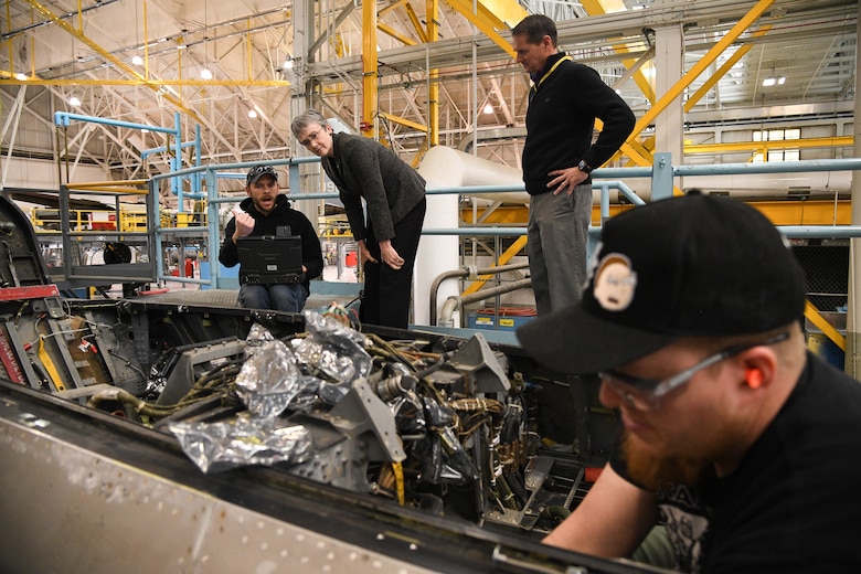 Cameron Weaver, 309th Aircraft Maintenance Group sheet metal mechanic, briefs Air Force Secretary Heather Wilson about F-16 depot maintenance during a base visit, Jan. 23, 2019, at Hill Air Force Base, Utah. The 309th AMXG is part of the Ogden Air Logistics Complex at Hill AFB, which is responsible for depot maintenance, repair, overhaul and modification of the A-10, C-130, T-38, F-16, F-22, F-35 and the Minuteman III Intercontinental Ballistic Missile system. (U.S. Air Force photo by R. Nial Bradshaw)